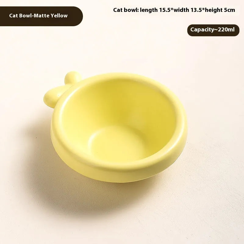 Porcelain cat drinking water bowl in bright red single grid configuration on surface