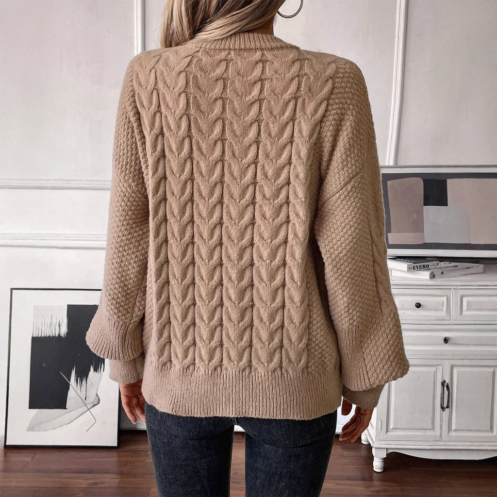 Beige women's loose casual sweater with a textured twist detail on the front.