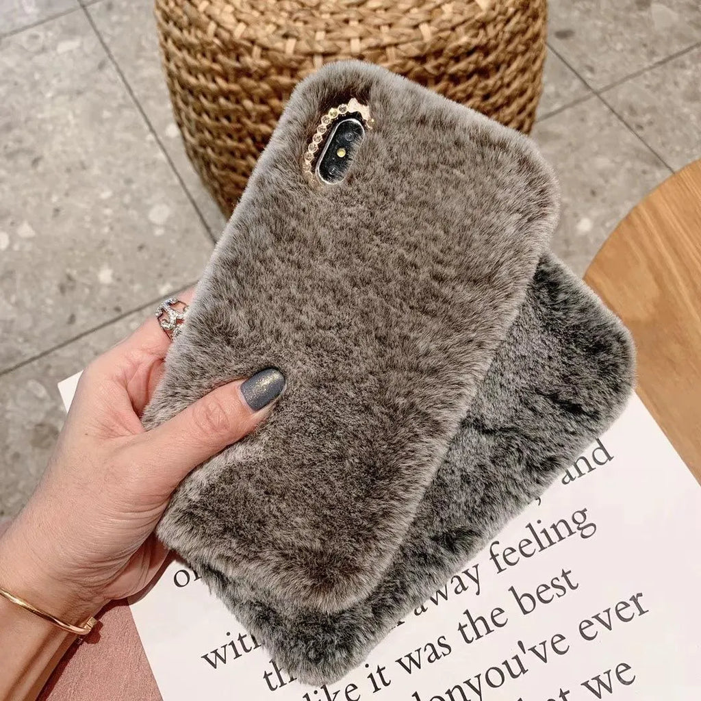 Rabbit hair silicone iPhone case with rhinestone detail, back cover in grey brown or pink plush for Apple iPhone models.