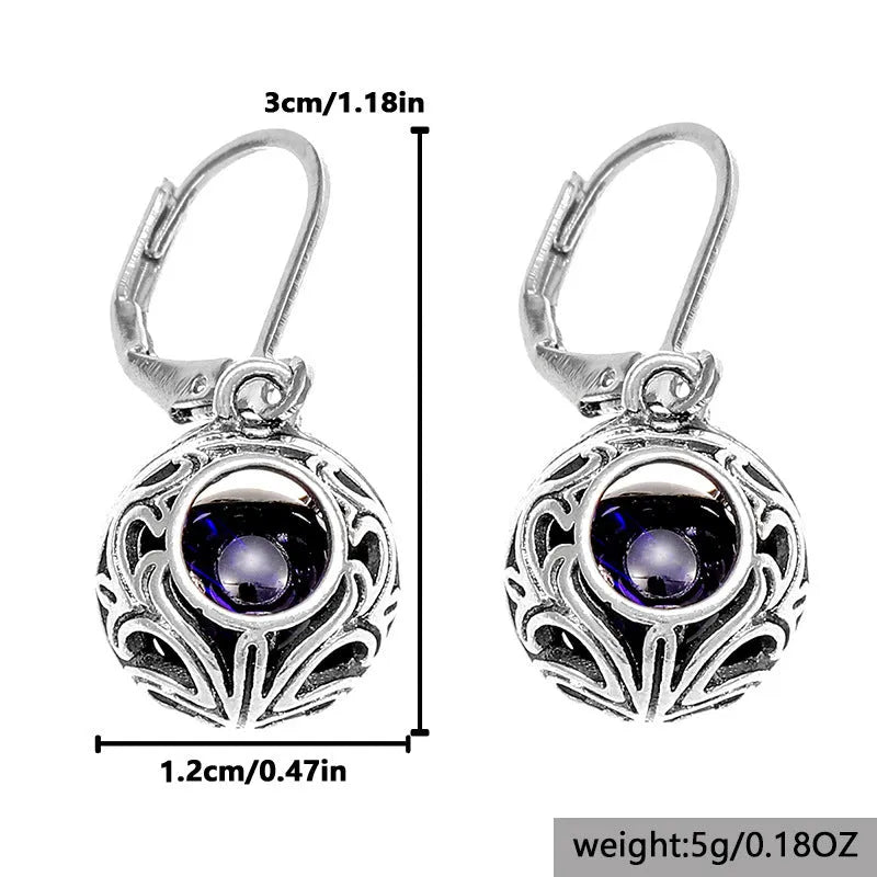Silver-coloured vintage engraving hollow geometric pendant earrings with blue gemstone