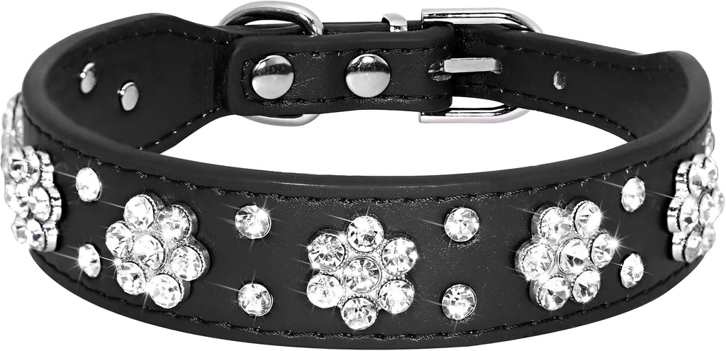 A black PU leather dog collar decorated with sparkling rhinestone flowers and metal studs, showing the adjustable eyelets and metal D-ring.