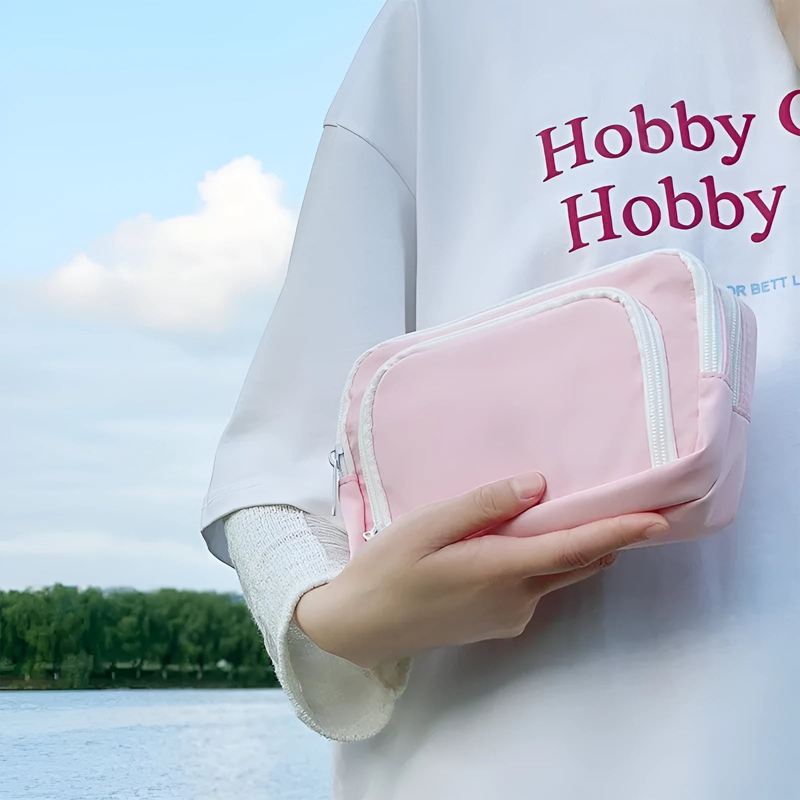 Double layer pencil case in solid colour with gift handle showing interior compartments