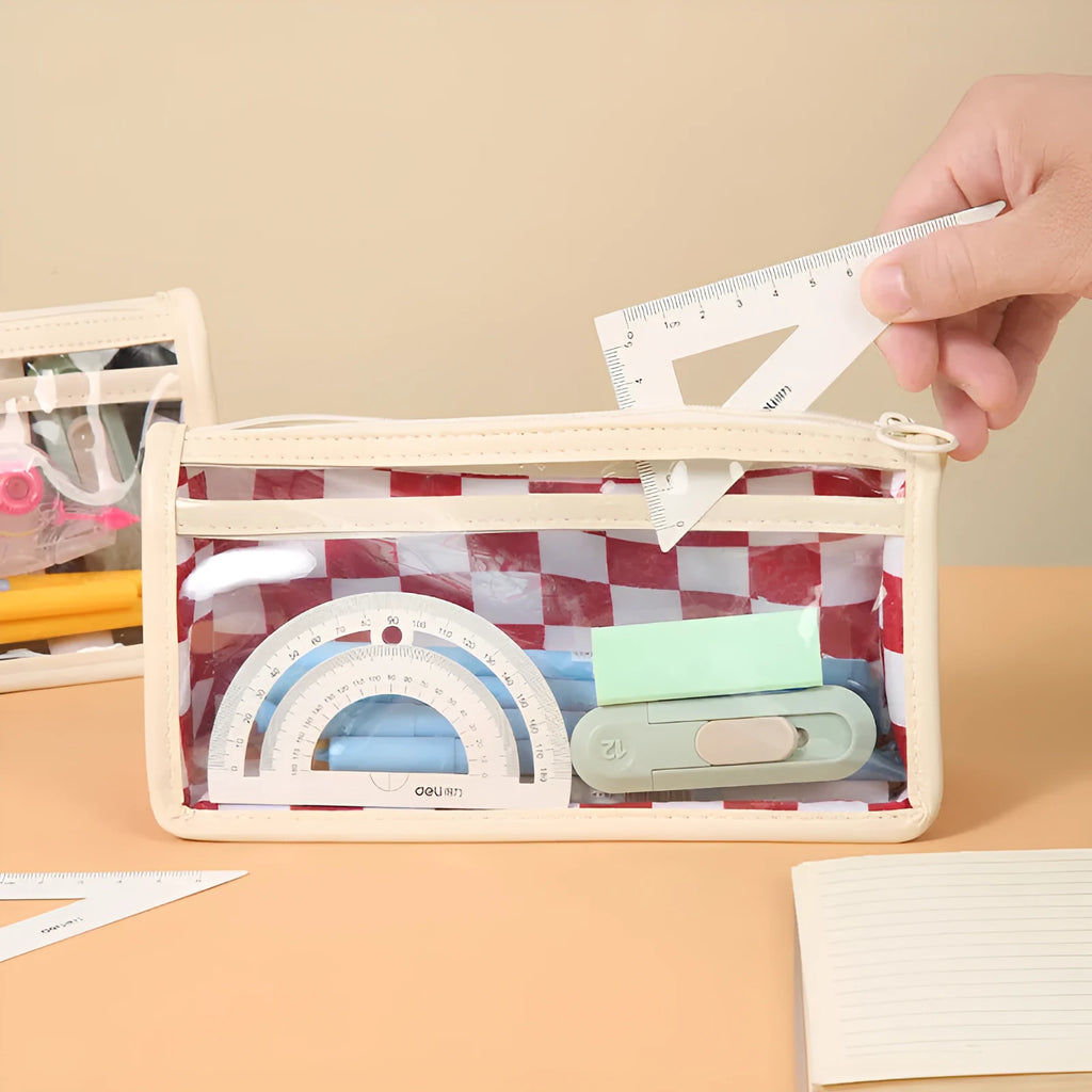 Transparent PVC pencil case with a chessboard pattern, showing pens inside.