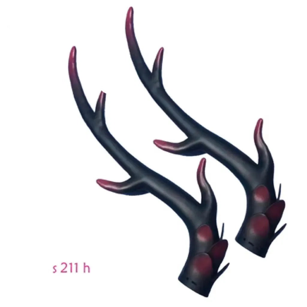 A pair of black resin dragon horn decorations for motorcycle helmets, showing curved shape and textured surface.