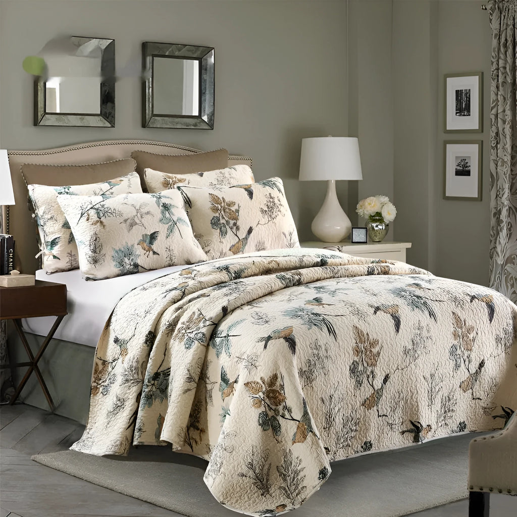 Quilted pure cotton bed cover and pillowcase set laid on a double bed, showing detailed printed pattern.