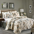 Quilted pure cotton bed cover and pillowcase set laid on a double bed, showing detailed printed pattern.