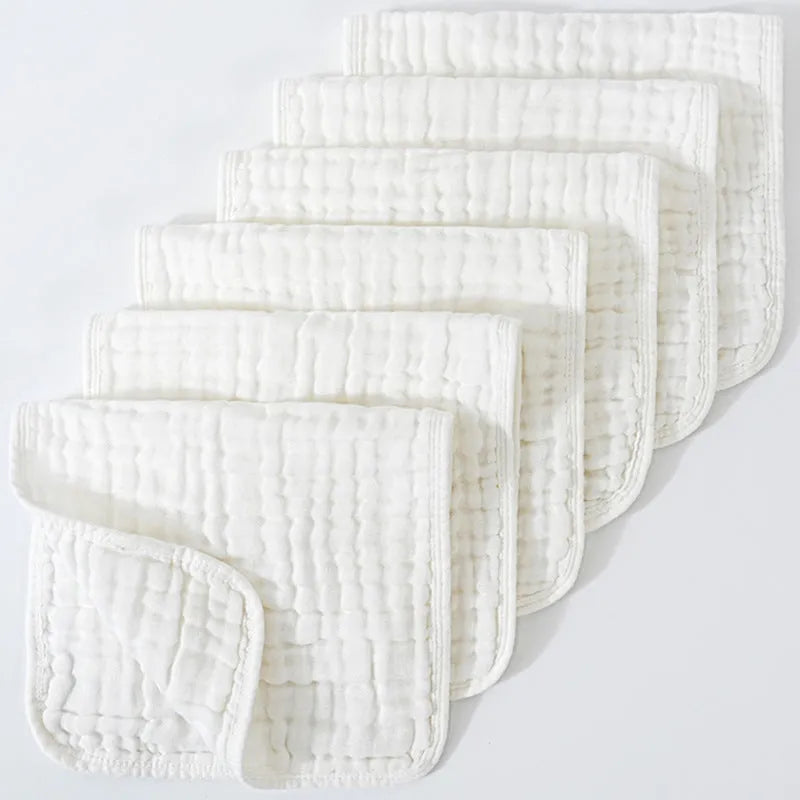 Set of six large muslin burp cloths 25x50cm in assorted colours on white background