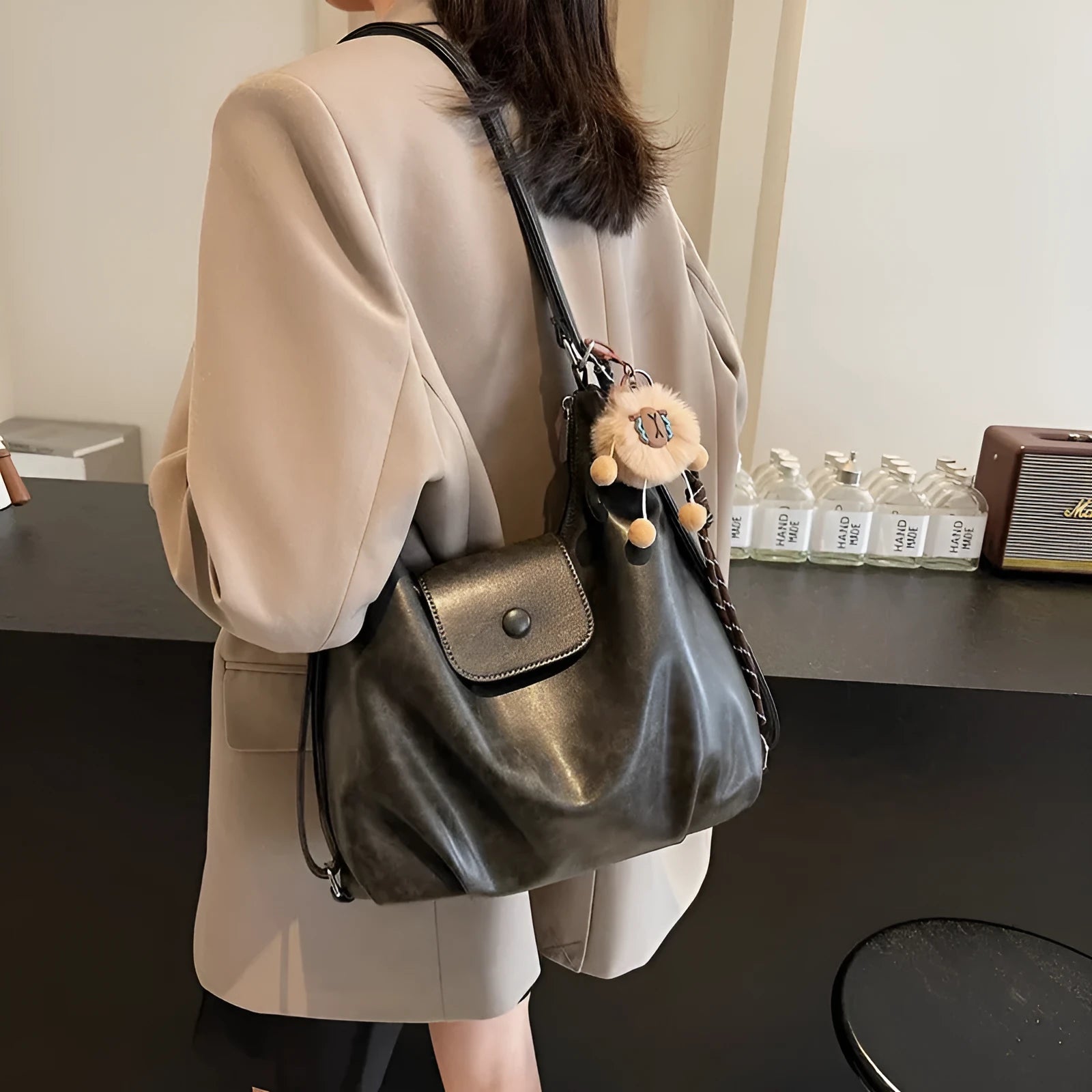 Large capacity textured PU commuter backpack with horizontal square shape and single shoulder strap