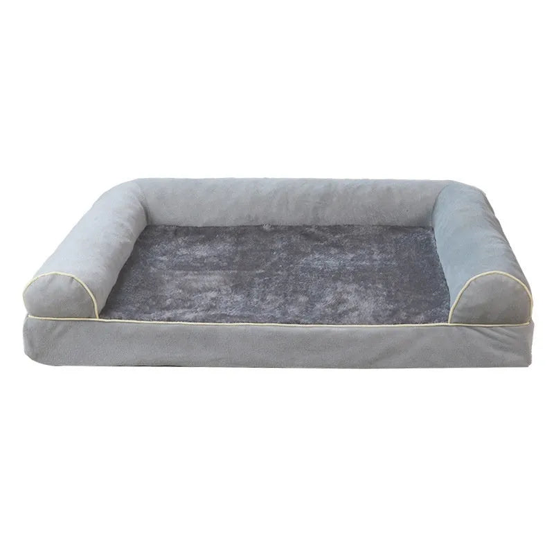 A square grey dog bed with a raised sponge can border on a wooden floor.