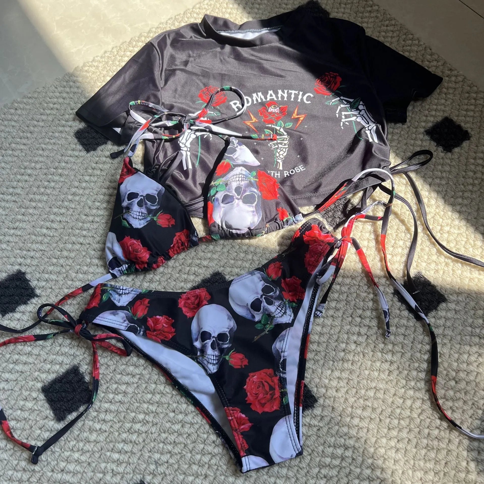 Skull rose printed three-piece swimwear set in red colour with swim trunks and short sleeves