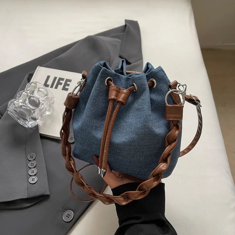 Blue synthetic leather cross body bucket bag with messenger design and shoulder strap