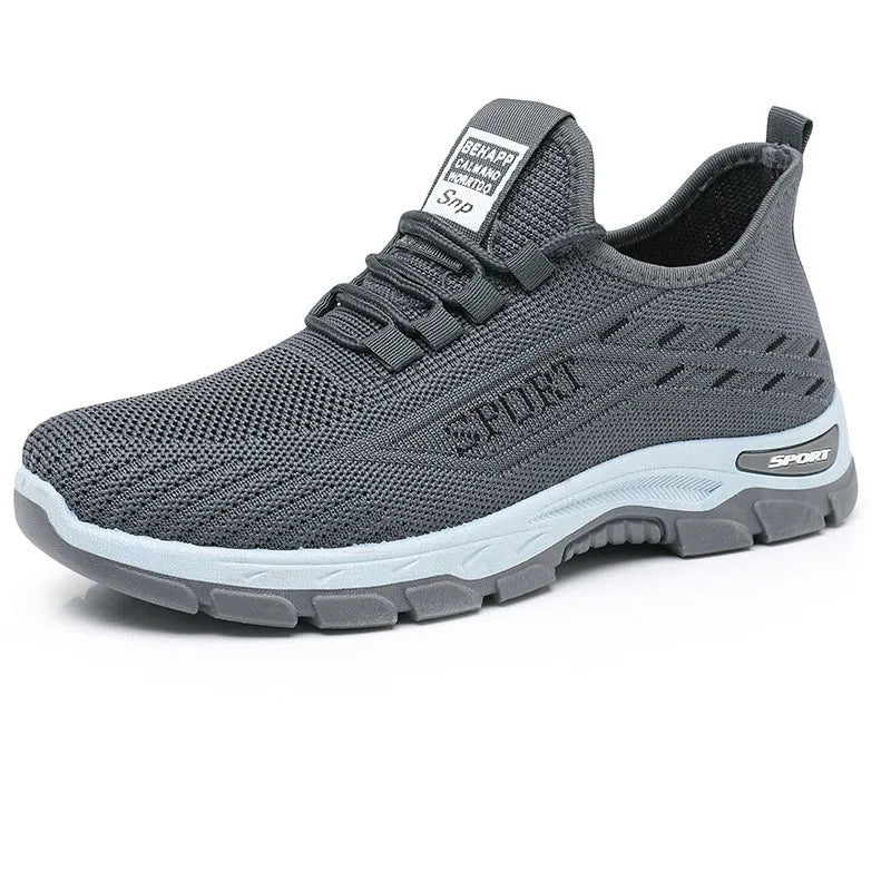 Low-top casual sneaker with round toe and PVC sole in black, shown on a white background.