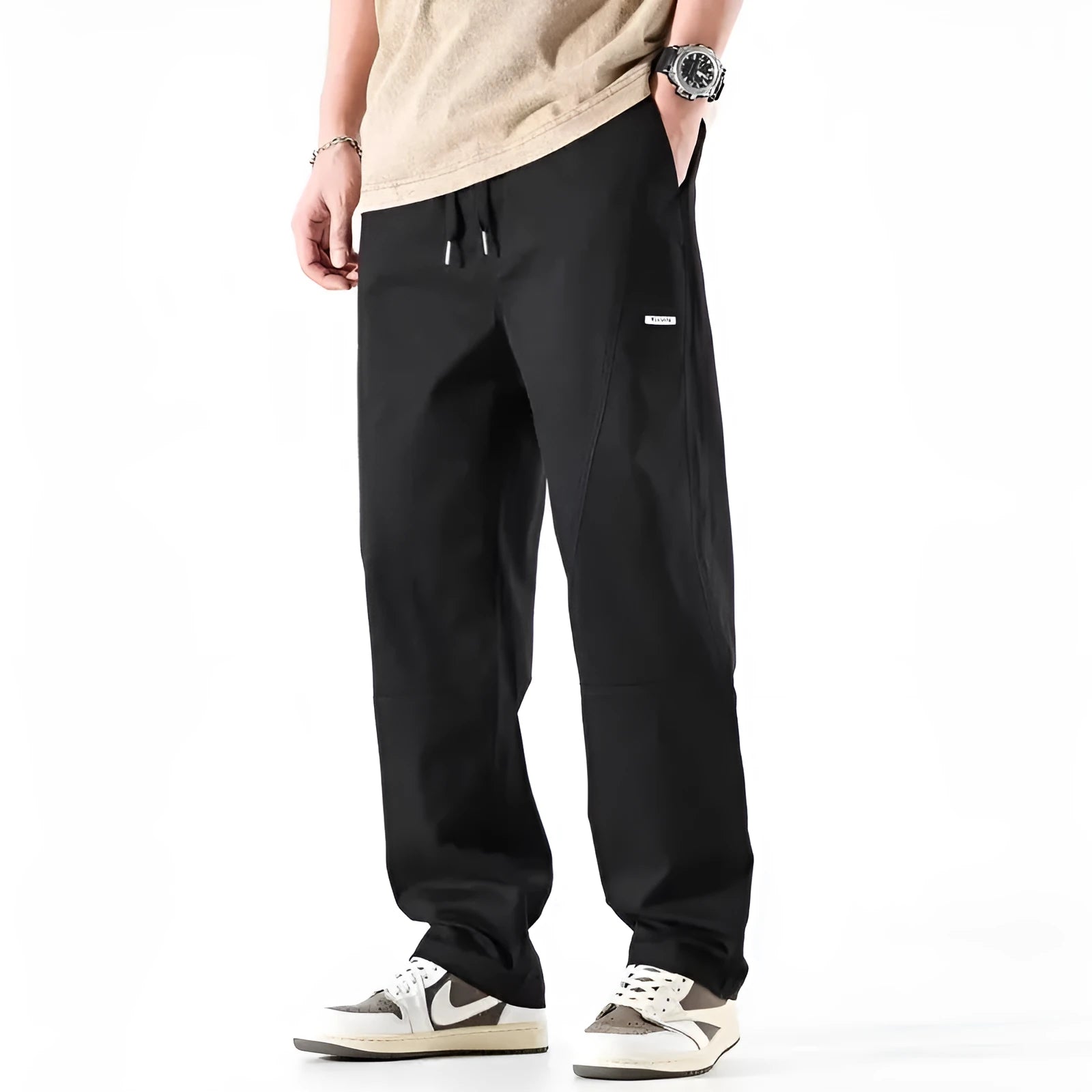Casual wide-leg cotton trousers in milky white on a model, showing the relaxed fit and trousers-mouth silhouette.