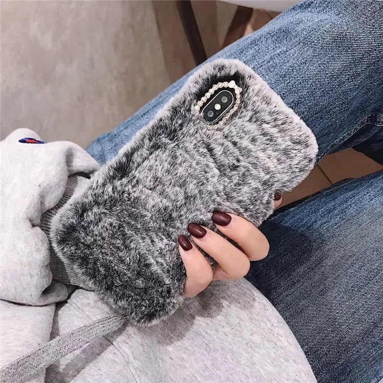 Rabbit hair silicone iPhone case with rhinestone detail, back cover in grey brown or pink plush for Apple iPhone models.