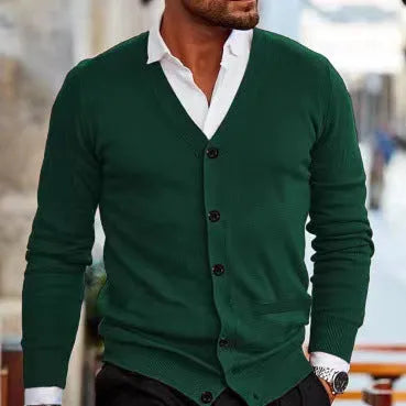 A man wearing a slim-fit, long-sleeve acrylic cardigan sweater coat in a dark green colour.