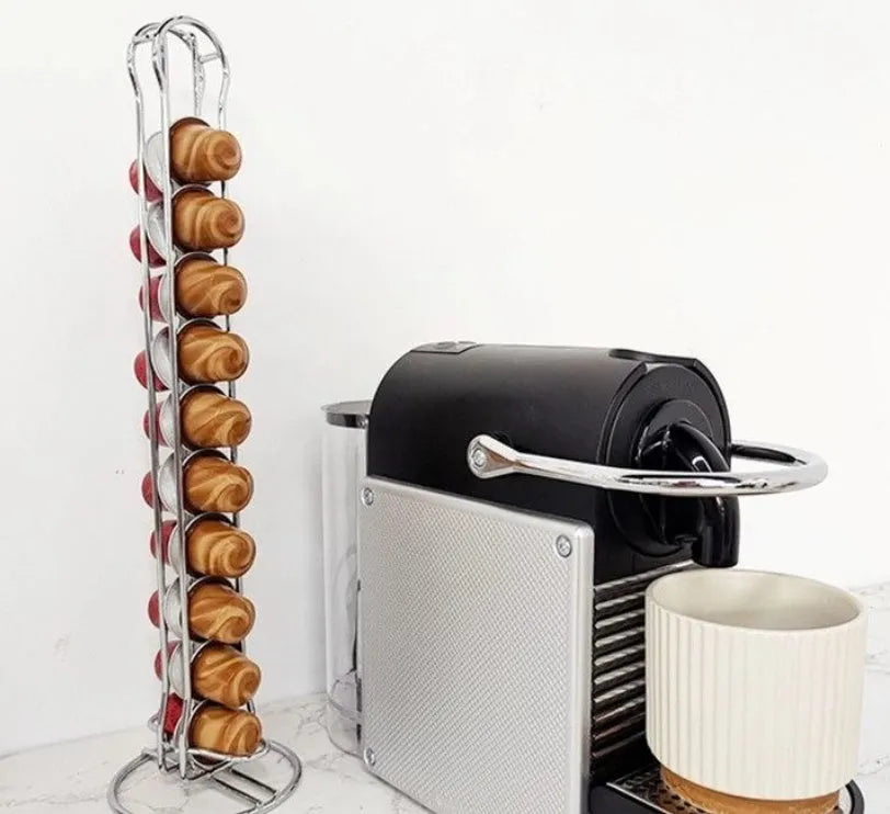 Black wrought iron coffee capsule storage rack holding 20 pods on a kitchen counter.