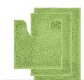 Dark green chenille U-shaped toilet mat with two matching rectangular bathroom mats on a tiled floor.