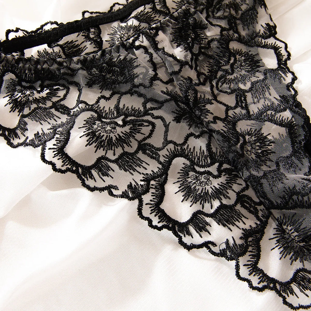 Black women's lace underwear set with embroidery and steel ring details on thin transparent fabric