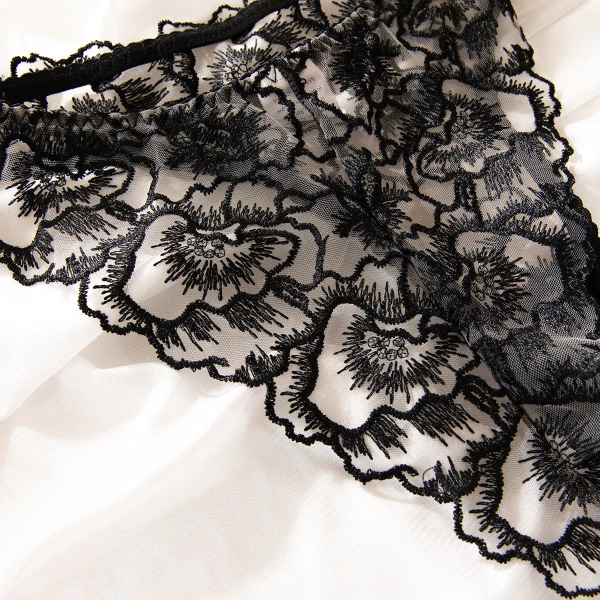 Black women's lace underwear set with embroidery and steel ring details on thin transparent fabric