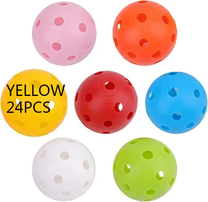 Multi-colour golf practice balls with 26-hole design on a green surface next to a net pocket.