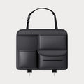 Black genuine leather car seat back hanging storage bag with a carry handle.