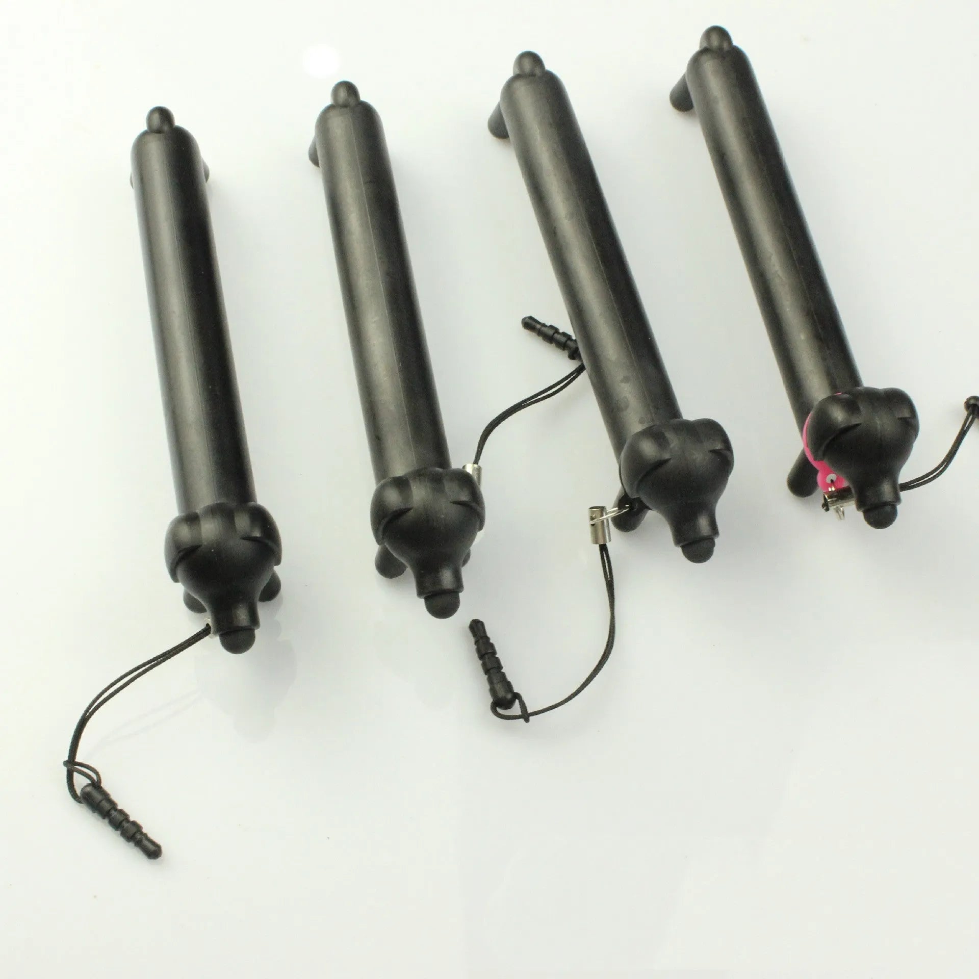Black dog-shaped touch screen stylus showing phone holder conversion and length adjustment