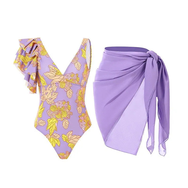 Women's solid colour spaghetti strap one-piece swimsuit with a matching skirt laid flat