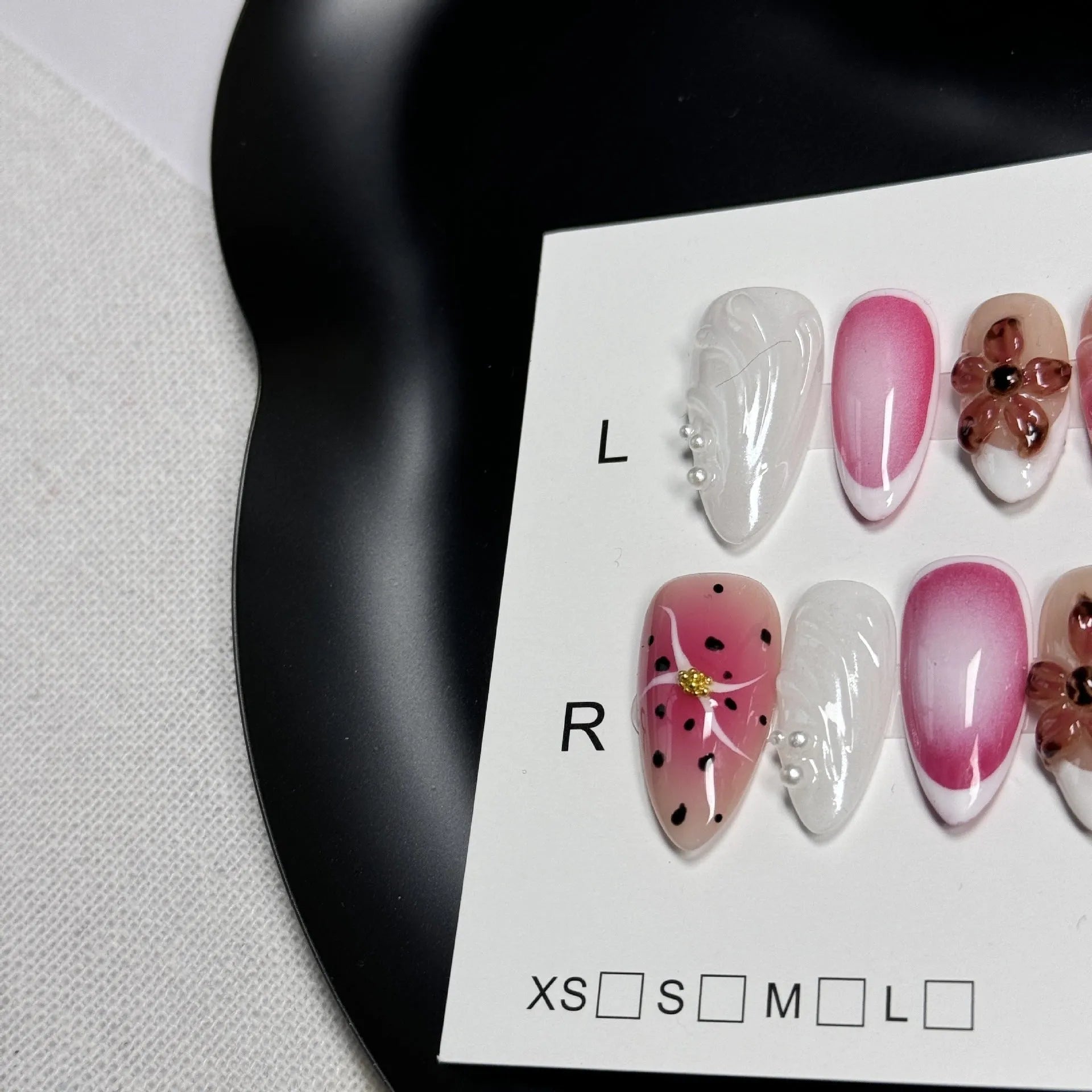 Hand-painted three-dimensional false nails with embossed carved patterns in candy colours.