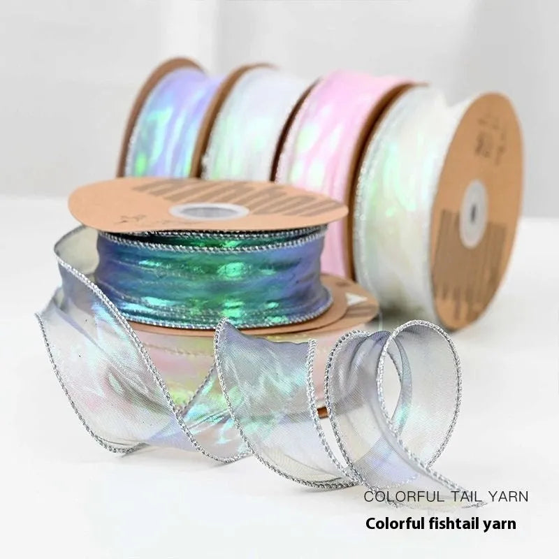 Roll of colourful mesh fishtail yarn wave ribbon with 4cm width for gift wrapping.