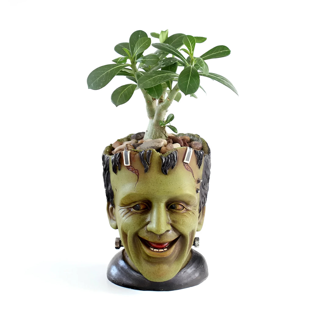 Green personalized resin flower pot with Frankenstein container design and drainage holes for desktop plant display