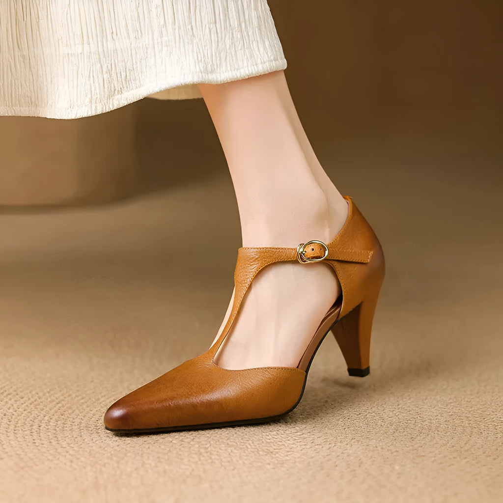Brown retro women's T-strap sandals with buckle closure and a closed round toe.