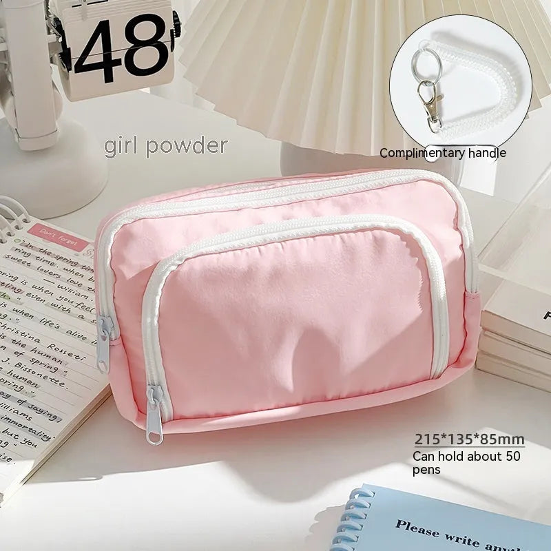 Double layer pencil case in solid colour with gift handle showing interior compartments