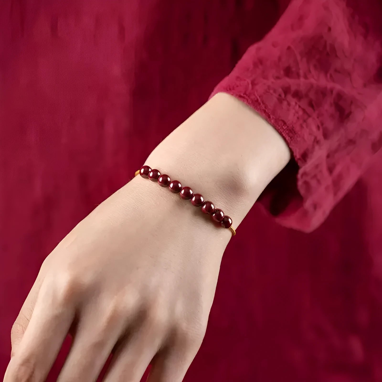 Hand-woven bracelet made of red cinnabar and raw Hetian Jade in a simple geometric shape.