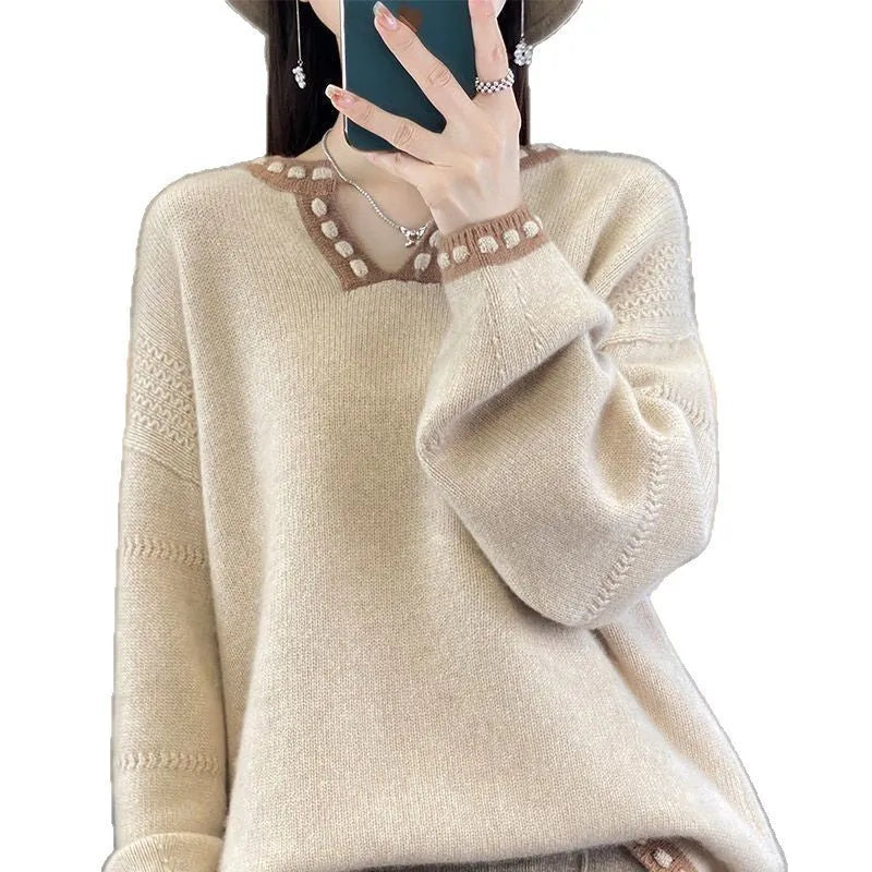 Women's white V-neck long sleeve viscose pullover sweater on a hanger.