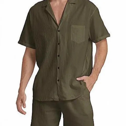 Man wearing a grey flax linen short-sleeved top and matching shorts from the summer sports suit set.
