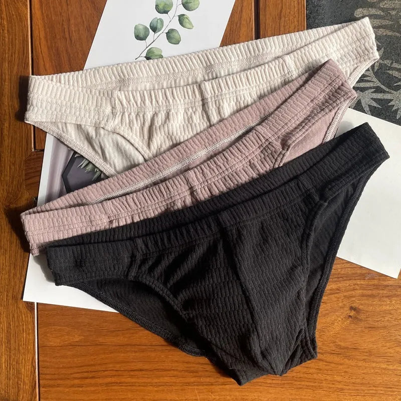 Men's solid colour cotton triangle underwear briefs showing mid waist design and available colour options