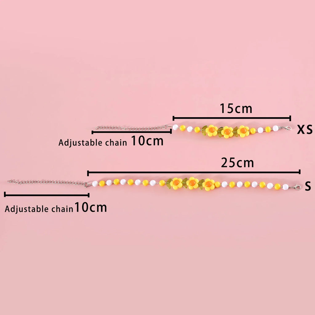Colourful plastic bead cat necklace on a white background, showing peach, rainbow, and small flower pattern options.
