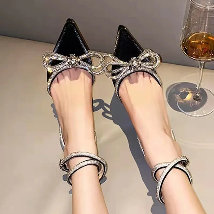 Women's black stiletto sandals with a silk bandage heel and buckle closure