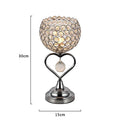 Modern minimalist crystal USB table lamp with heart-shaped design on a bedside table