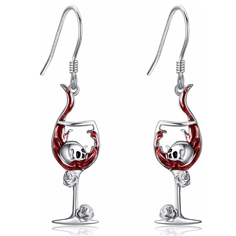 A pair of zinc alloy electroplated earrings depicting a skull inside a wine glass shape.