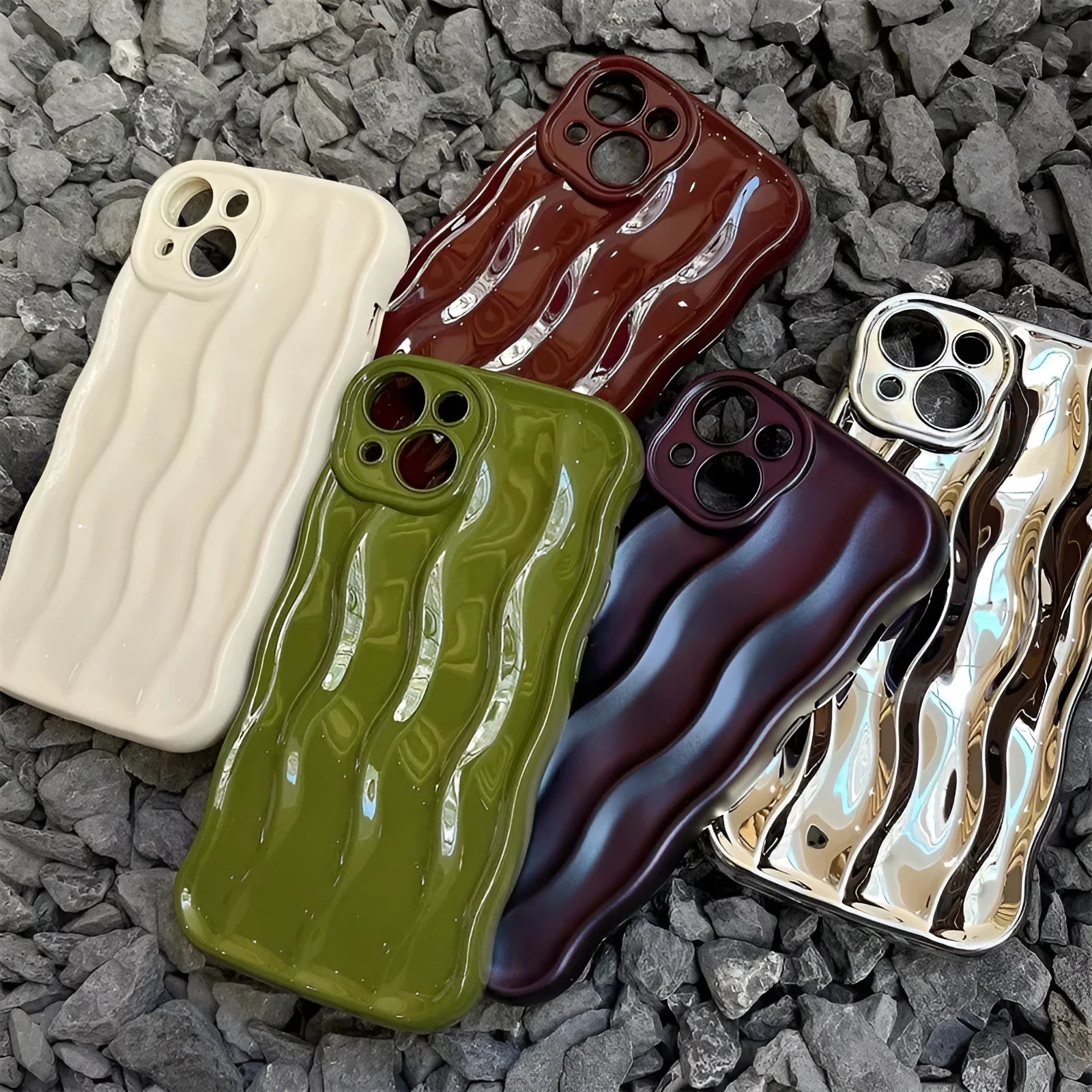 Silicone iPhone 17 phone case with water ripple texture in green, shown fitted to a phone.