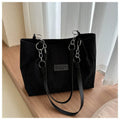 Corduroy one-shoulder tote handbag in black, brown, or white with horizontal square silhouette