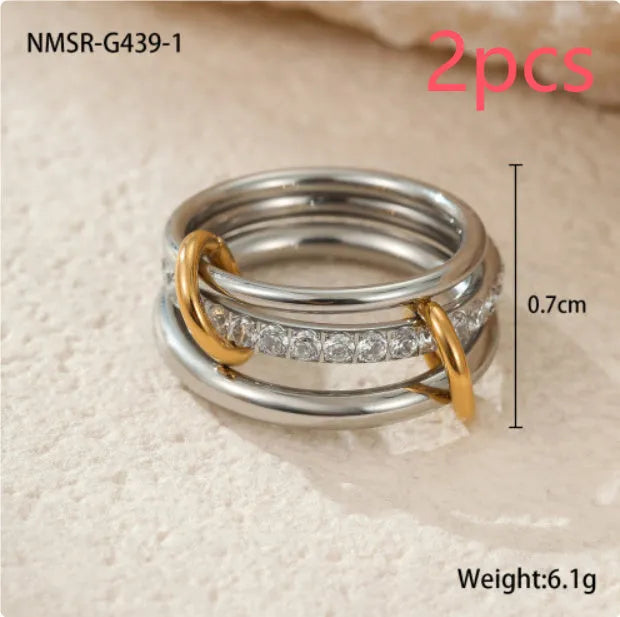 Stacked gold plated stainless steel rings with an exaggerated wide band design, shown in a free size.