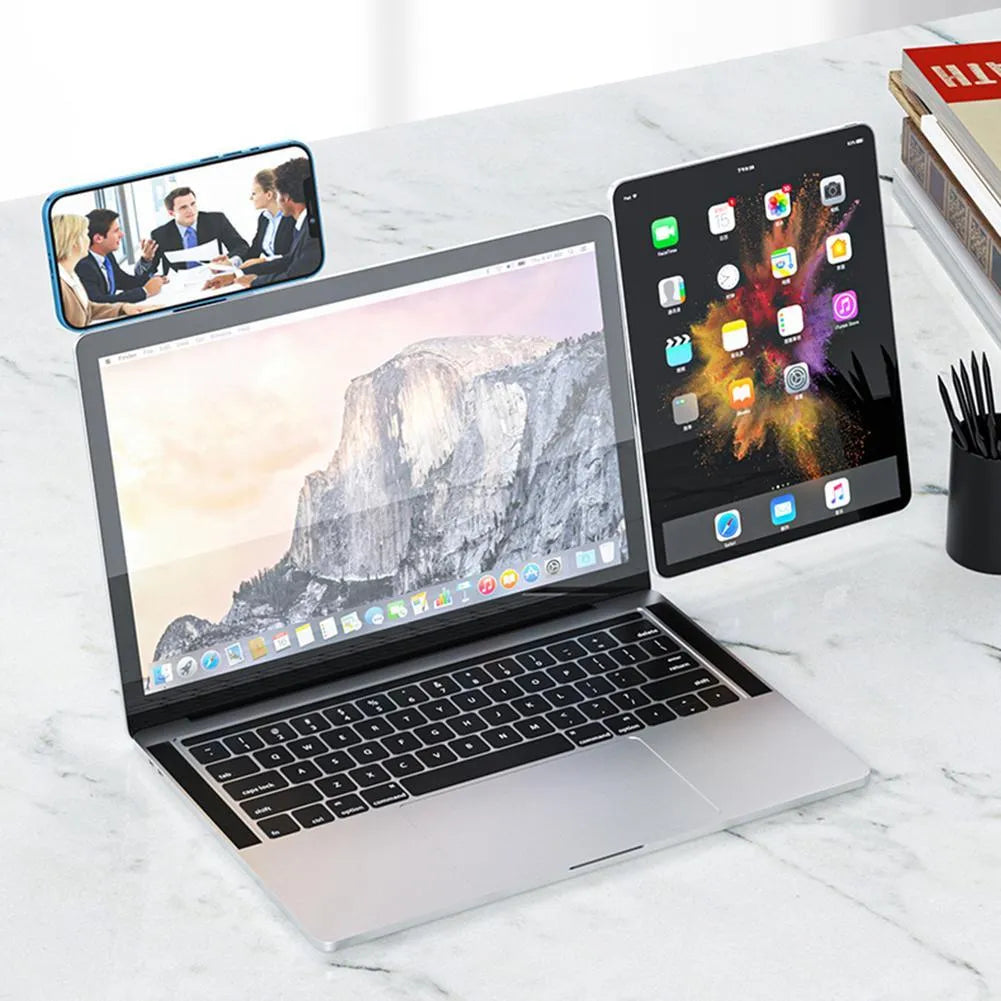 Black aluminium laptop phone holder with magnetic mount attached to laptop side displaying smartphone