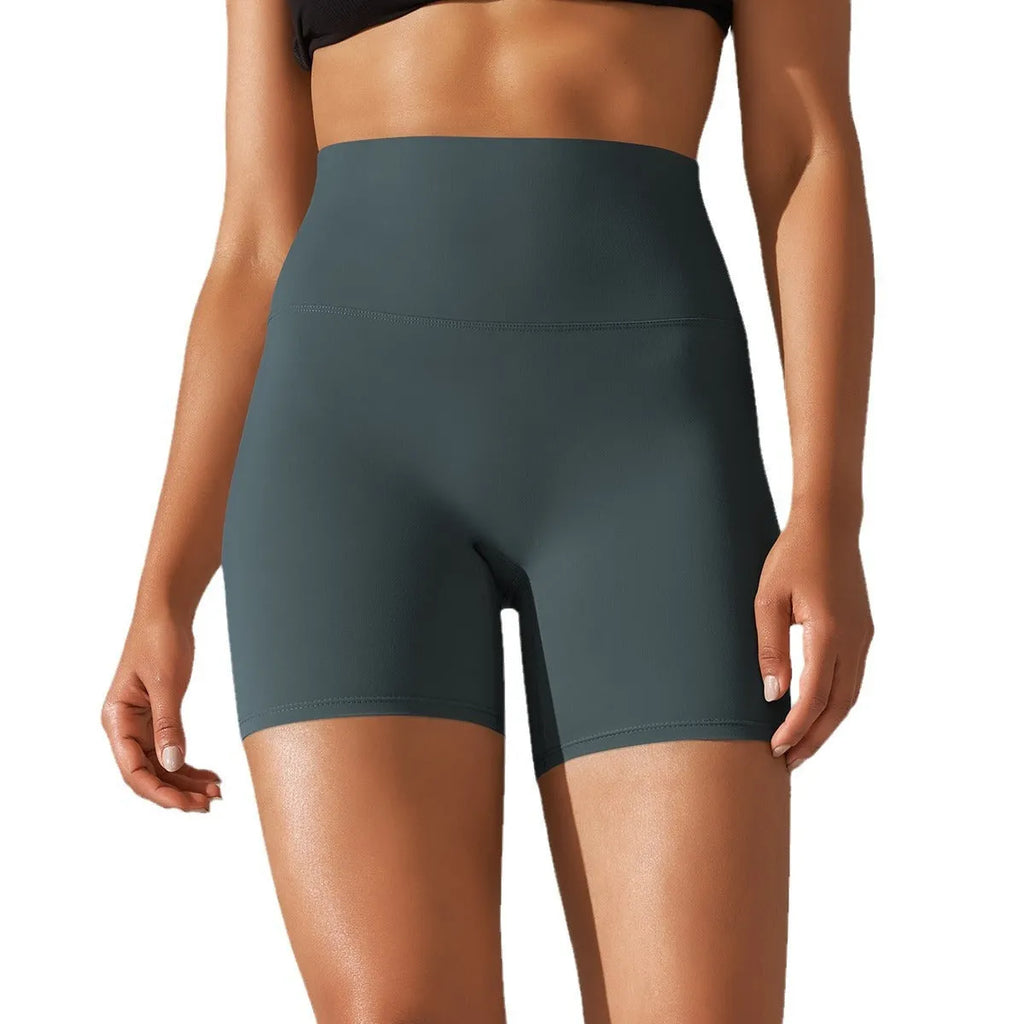 Women's high waist fitness tights in dark green colour with belly contracting design and hip lift construction