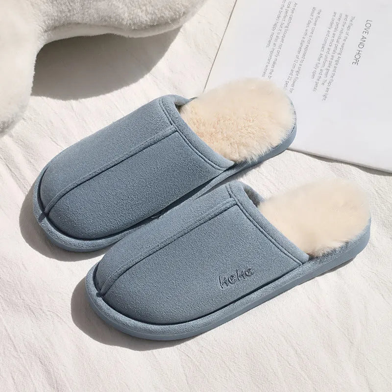 Pair of warm plush cotton slippers with TPR sole in beige on a tiled floor