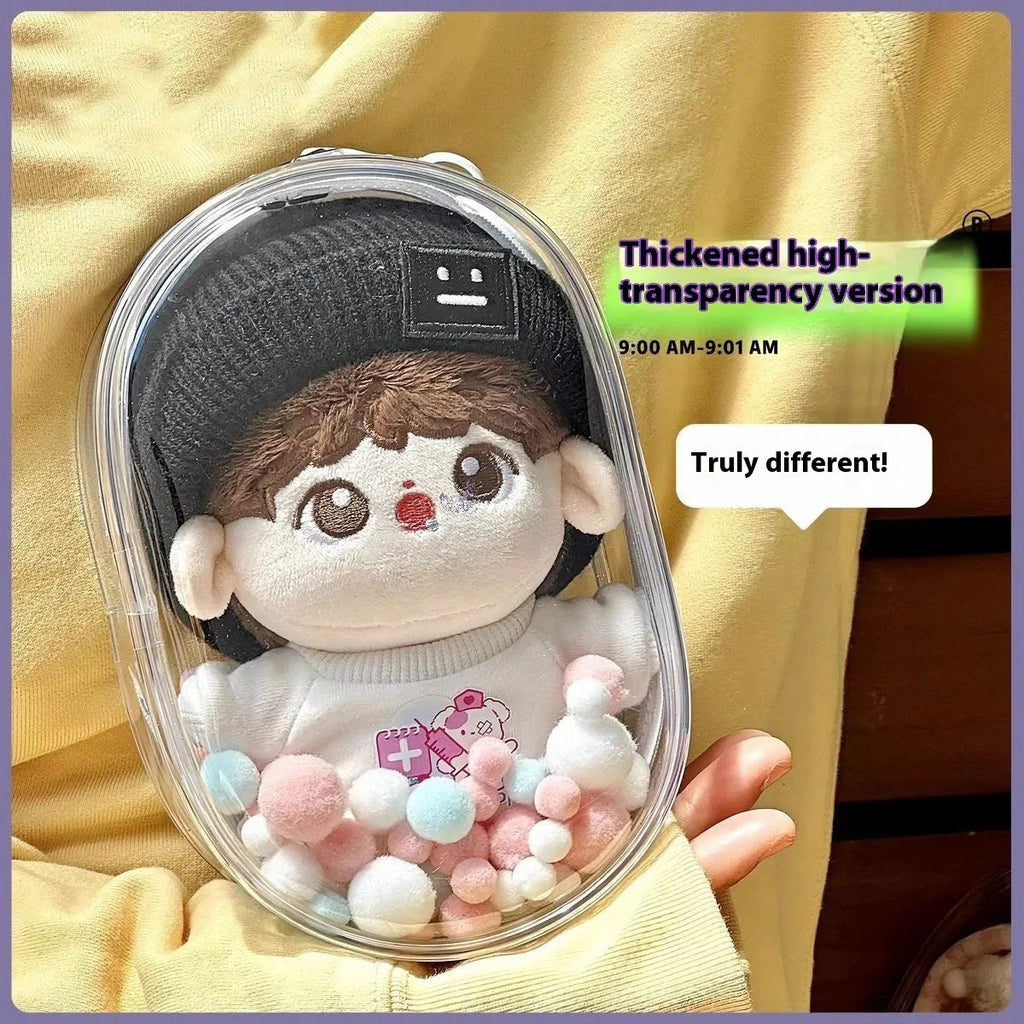 Transparent PVC cube-shaped storage bag with colourful ball keychain for doll drying and organisation.
