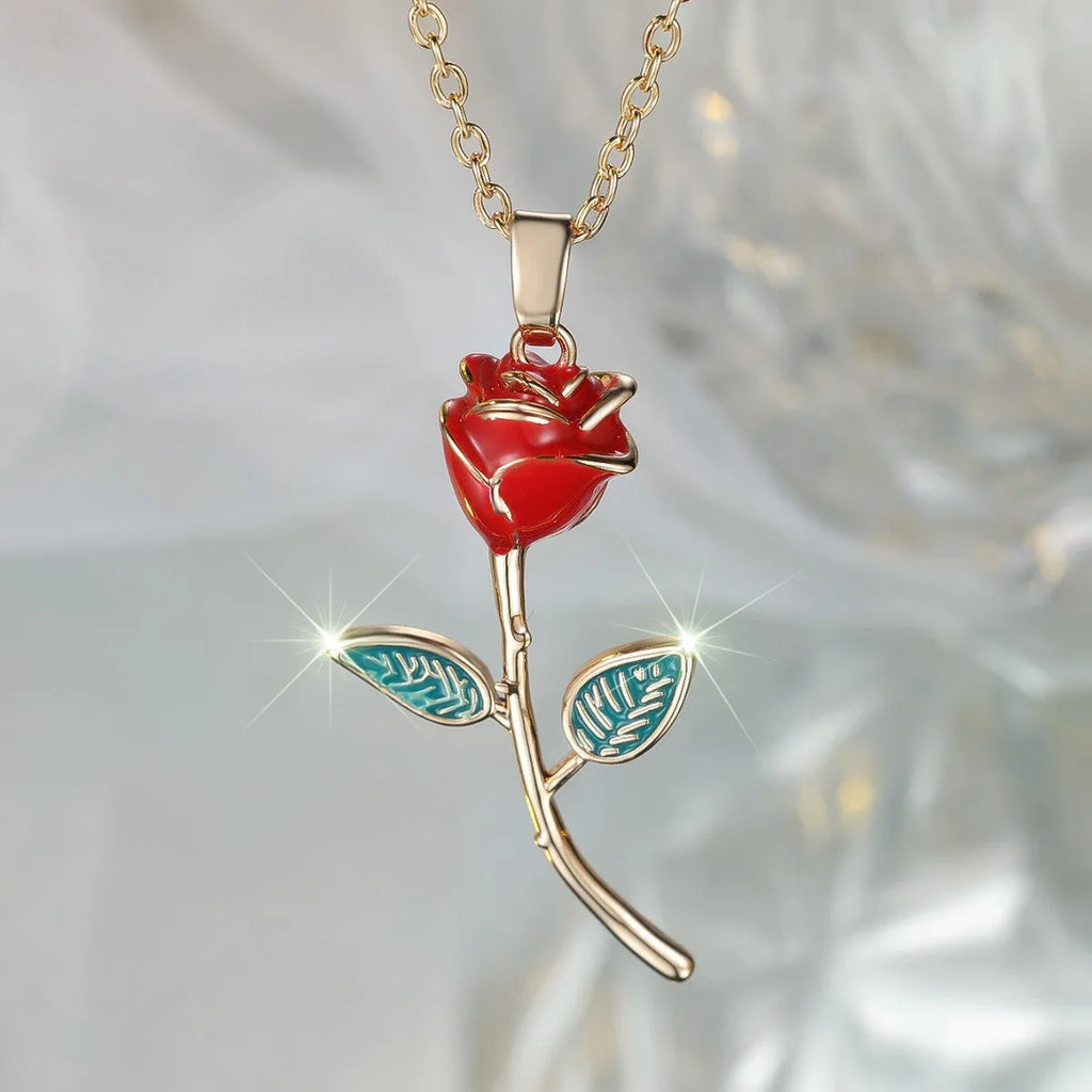 Champagne gold rose pendant necklace with copper drip oil finish and O-ring chain on display