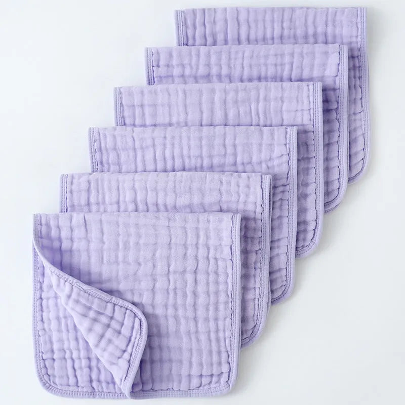 Set of six large muslin burp cloths 25x50cm in assorted colours on white background
