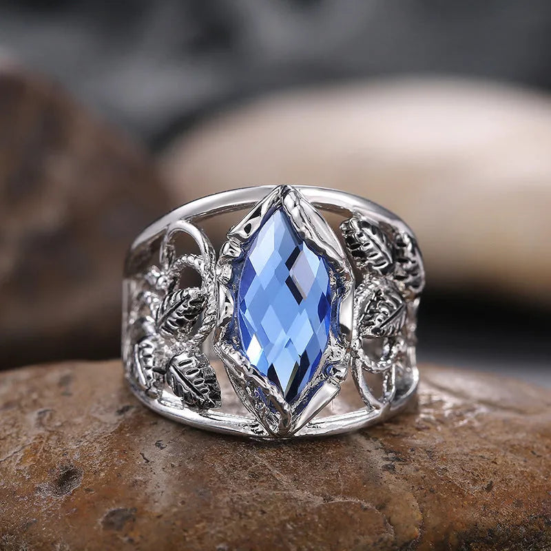 Women's blue crystal horse eye-shaped geometric alloy ring on a white background.